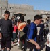 Soldiers hand out soccer balls in Tal Afar