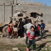 Soldiers hand out soccer balls in Tal Afar