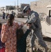 Soldiers hand out soccer balls in Tal Afar