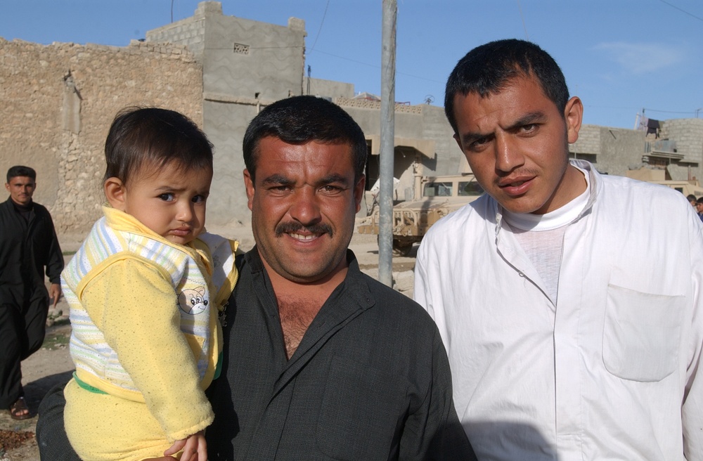 Soldiers hand out soccer balls in Tal Afar