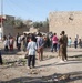 Soldiers hand out soccer balls in Tal Afar