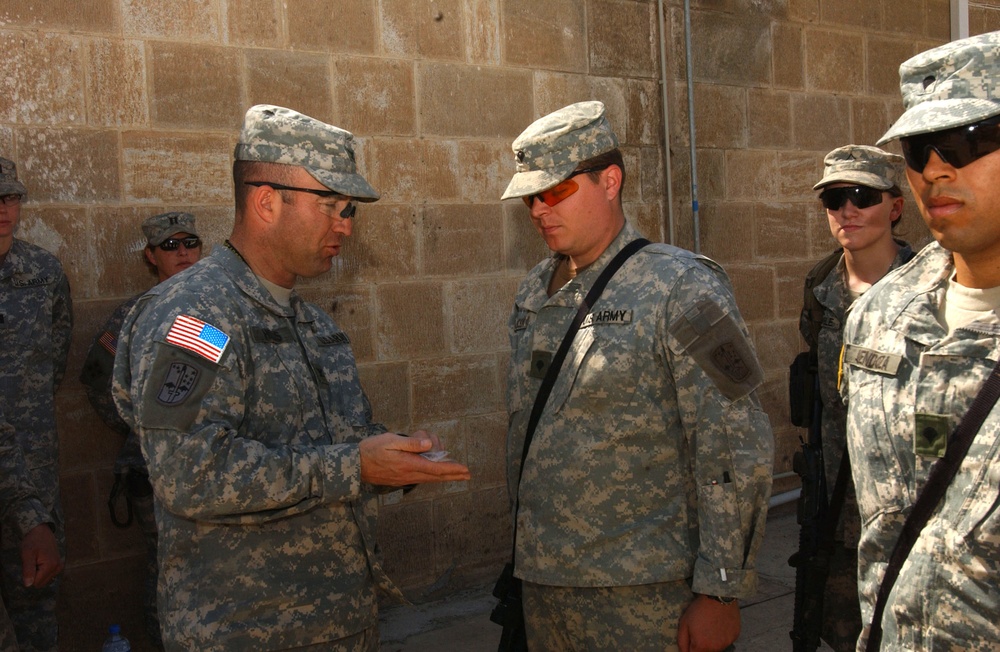 Col. Shields hands out awards at FOB Marez