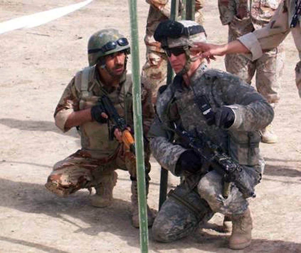 Staff Sgt. Gardner teaches an Iraqi NCO