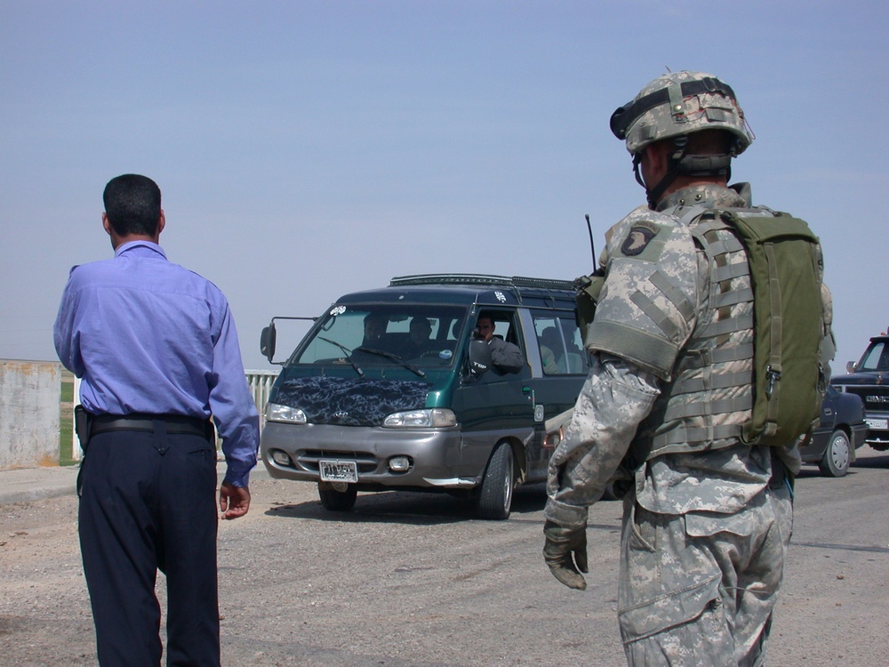 1st. Lt. Yukitoshi Murasaki inspects Iraqi Police post
