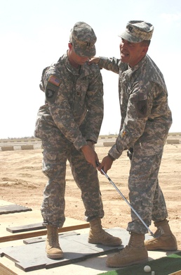 Capt. Mark Flitton Gives a Golf Lesson in Tikrit, Iraq