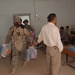 Staff Sgt. Washington Hands Out Bags of School Supplies