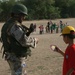 Iraqi Soldier Passes Out Stickers