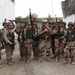 Iraqi Soldiers Joke With Marine Adviser
