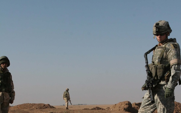 Pfc. Malinowski instructs Soldiers on how to properly search for caches