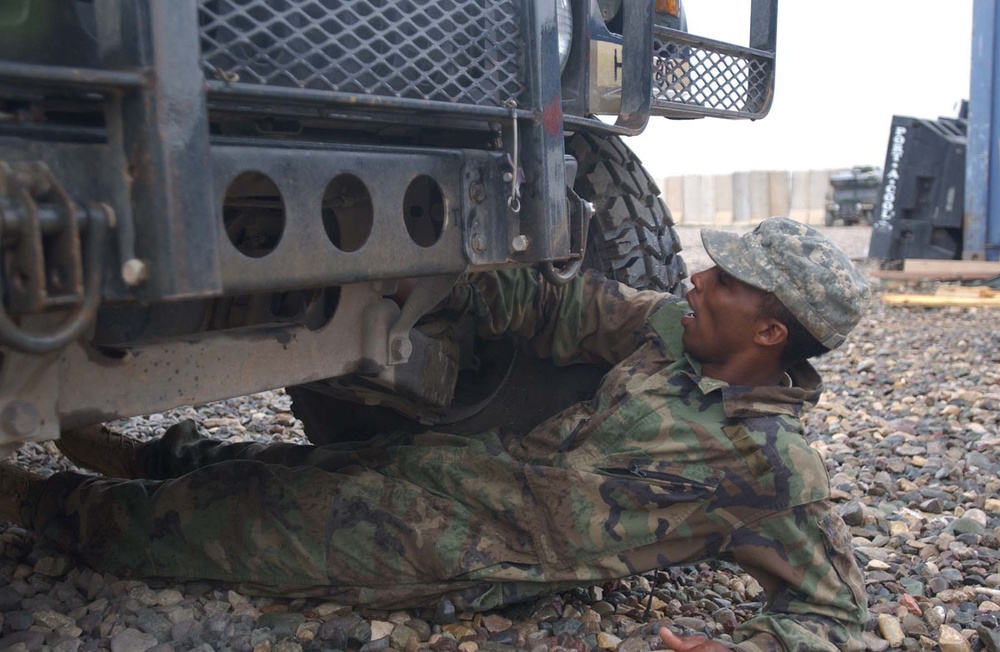 Sgt. Knight bleeds the front brakes on a humvee