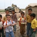 Iraqi children greet Soldiers