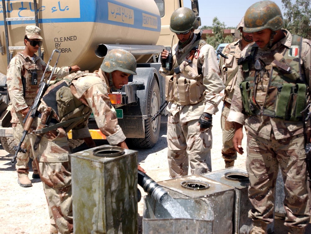 Soldiers help Babil village