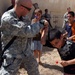 Orphans receive pool from 172nd Stryker Brigade