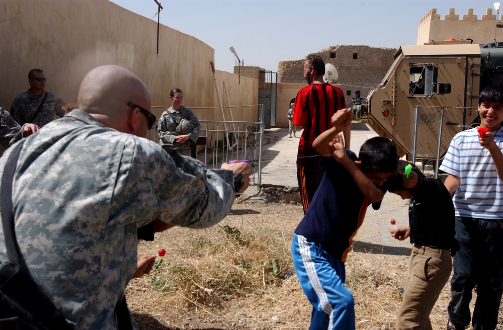 Orphans receive pool from 172nd Stryker Brigade
