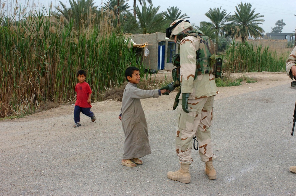 Soldiers Bring Toys to Taji