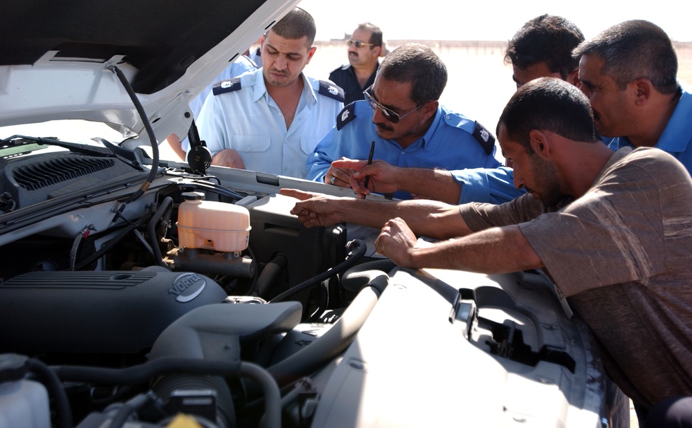 Iraqi police see new police trucks as symbols of progress
