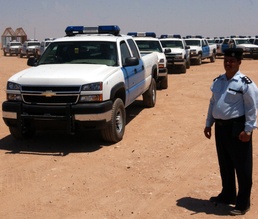 Iraqi police see new police trucks as symbols of progress