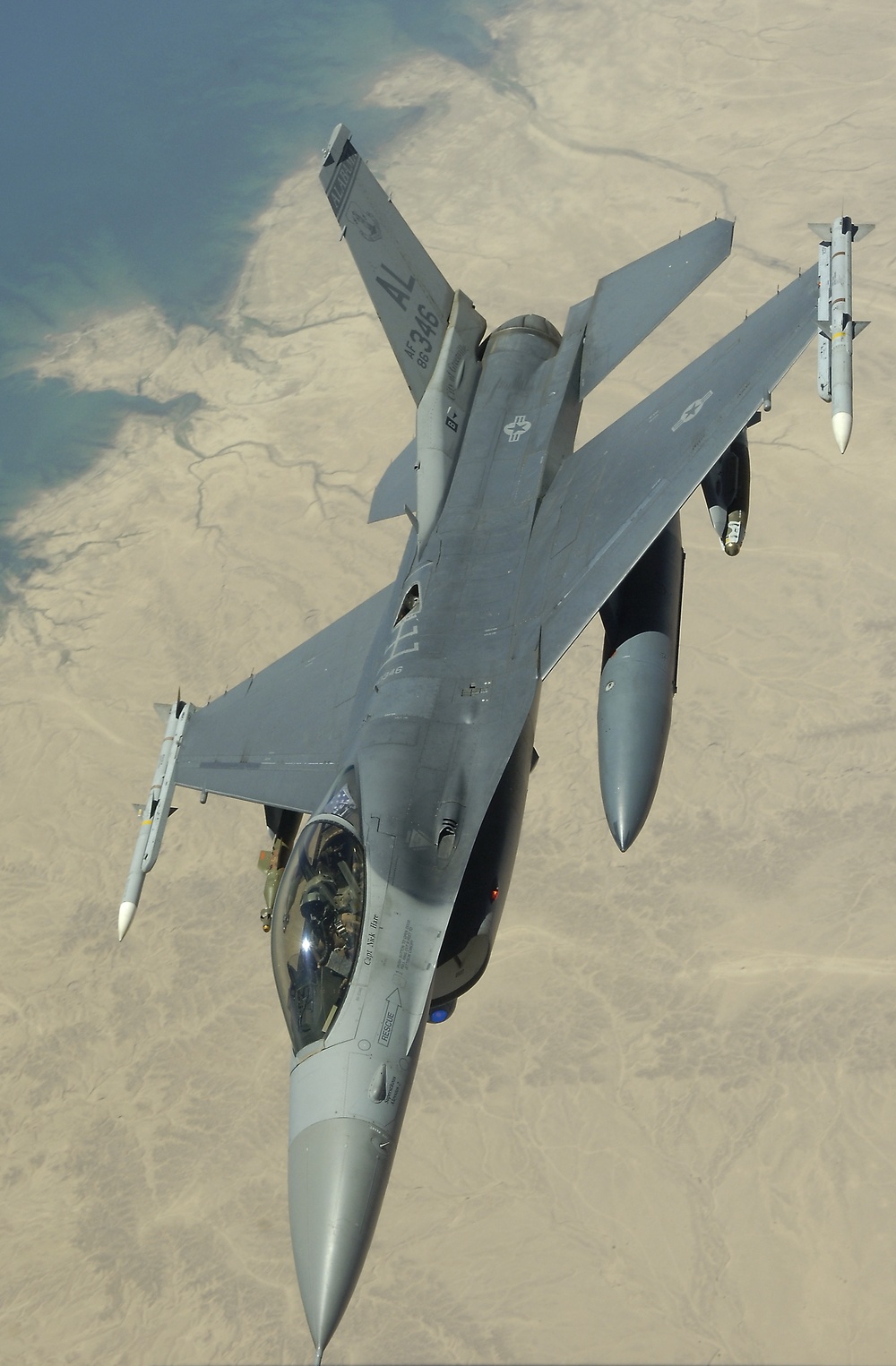 An F-16 Fighting Falcon flies a close air support mission over Iraq