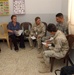 navy Lt. Cmdr Eckert visits womens's center