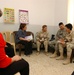 navy Lt. Cmdr Eckert visits womens's center