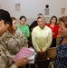 navy Lt. Cmdr Eckert visits womens's center