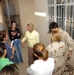 navy Lt. Cmdr Eckert visits womens's center