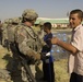 Iraqis and U.S. Troops Pass Water