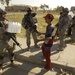 Iraqis and U.S. Troops Pass Water