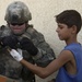 Medic Treat Iraqi Child