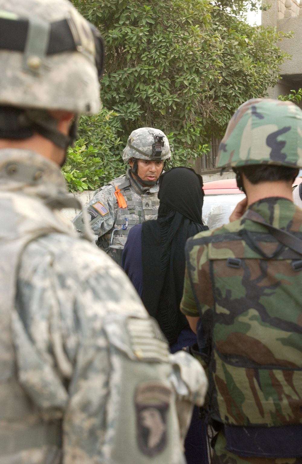 Soldier Speaks With Iraqi Woman