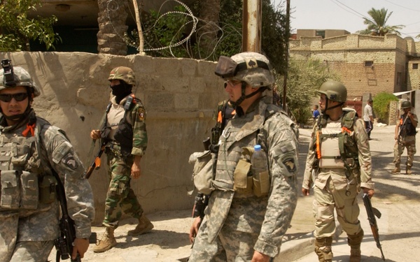 INPs and US Troops Move Through the Streets of Iraq