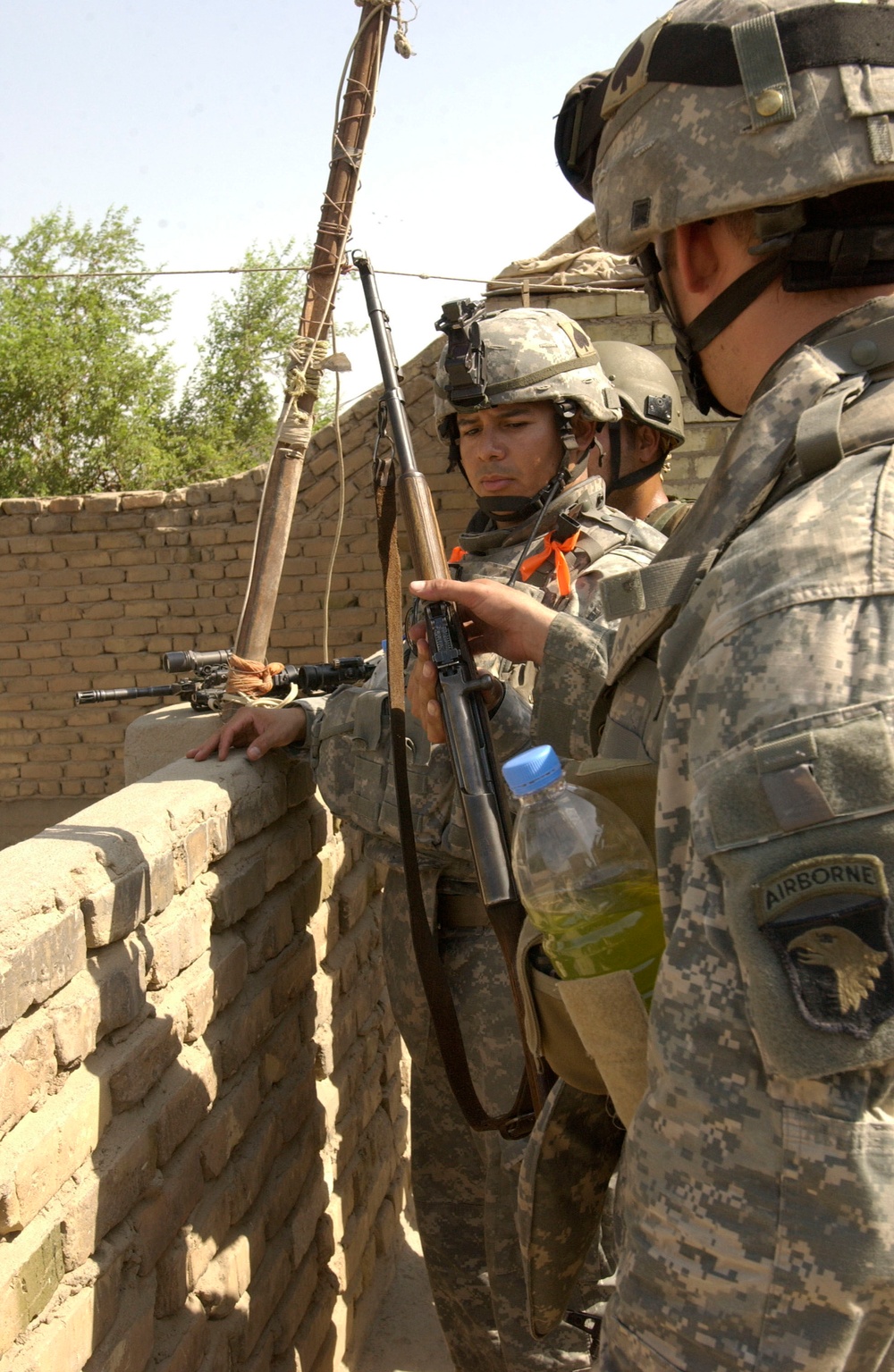 US Troops Inspect Weapon