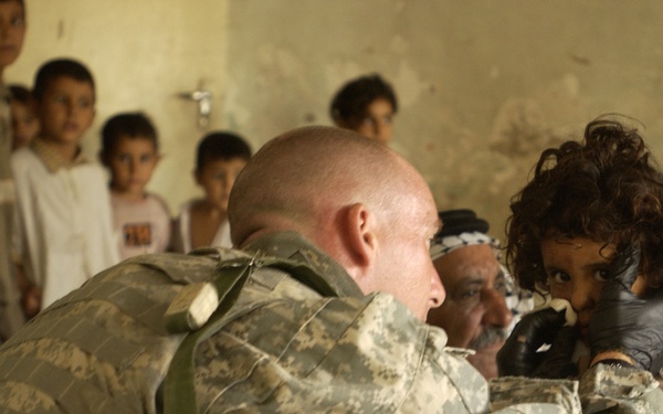 Medic Aids Iraqi Child