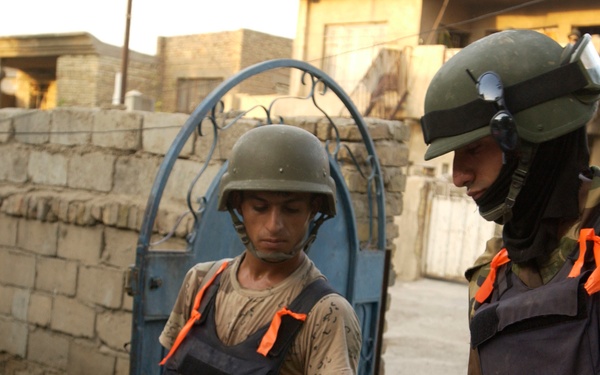 Iraqis Search Vehicles in Dora