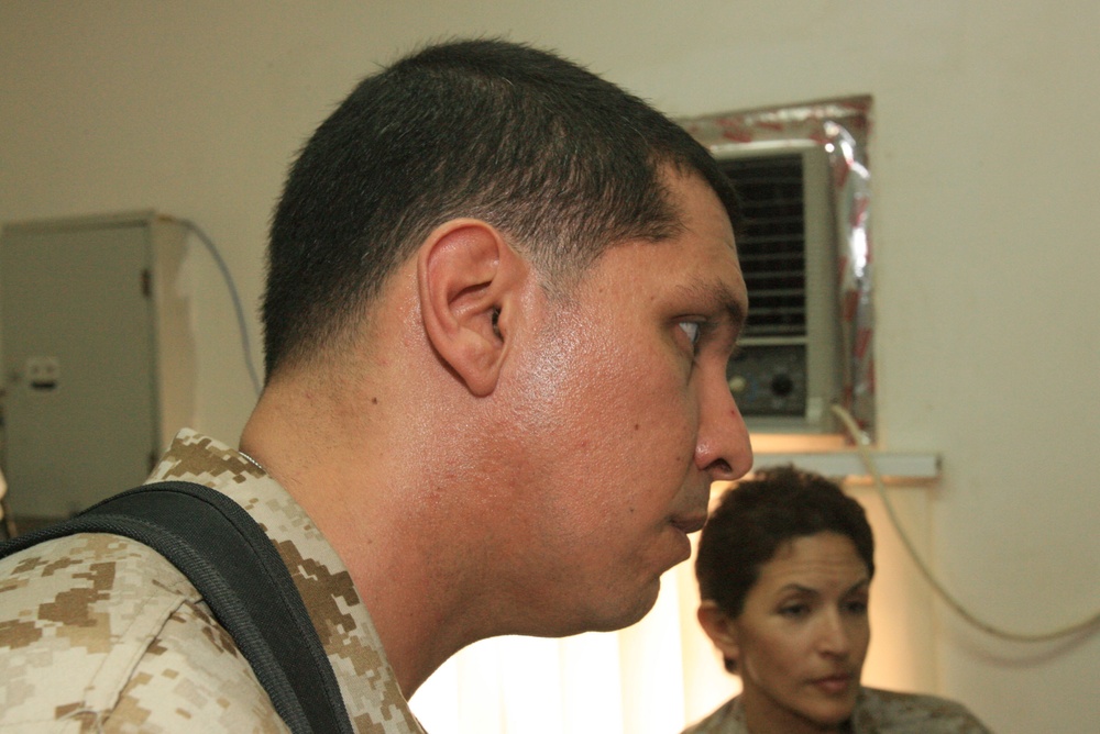 RCT-5 doctors examine deaf Fallujah girl