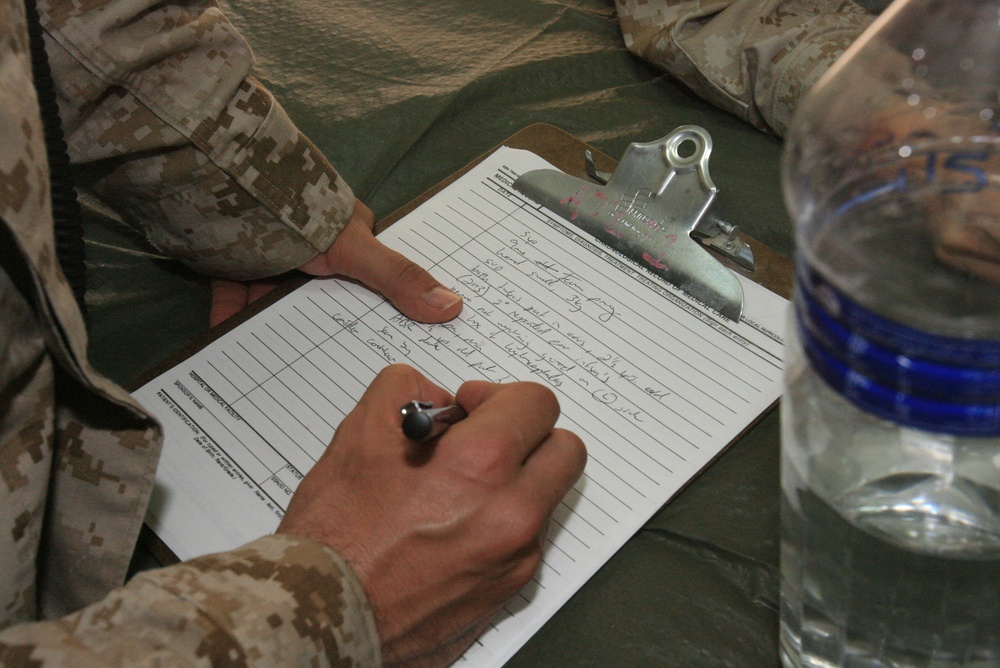 RCT-5 doctors examine deaf Fallujah girl