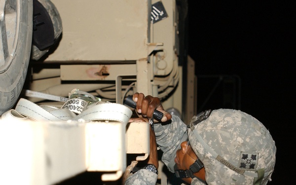 Co. A, 4th Spt. Bn., remove disabled IP vehicles