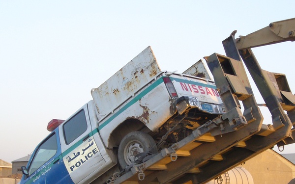 Co. A, 4th Spt. Bn., remove disabled IP vehicles