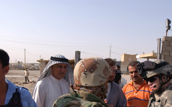 MND-B Soldiers, IPs walk beat in Taji, Assyria