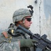 Soldiers Walk Through Al-Karama Neighborhood