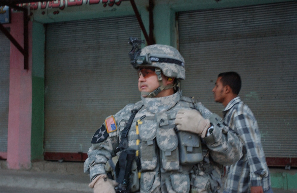 Soldiers Walk Through Al-Karama Neighborhood