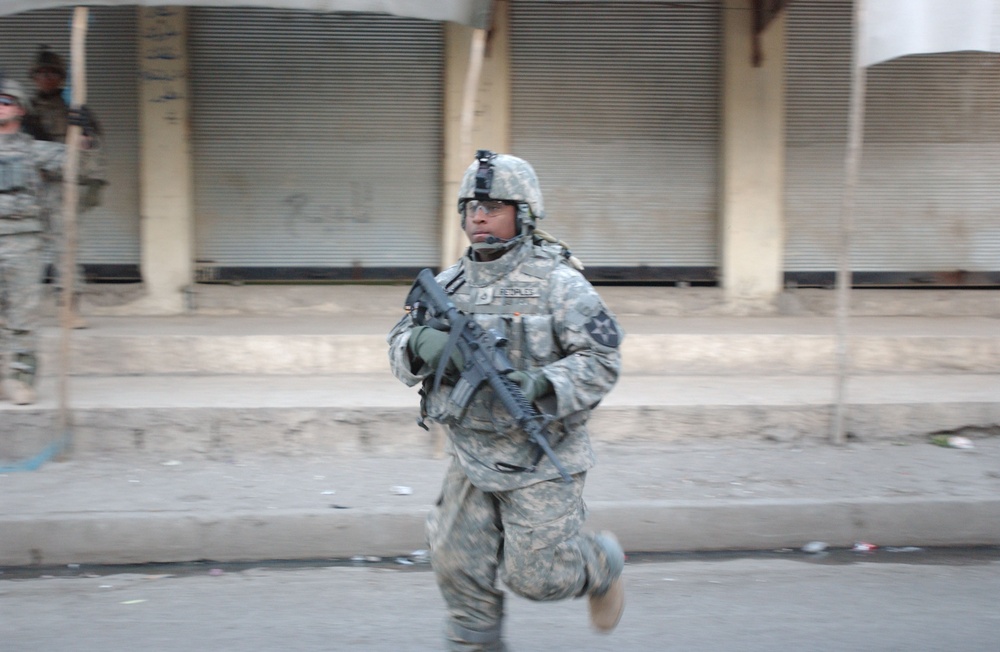 Soldiers Walk Through Al-Karama Neighborhood