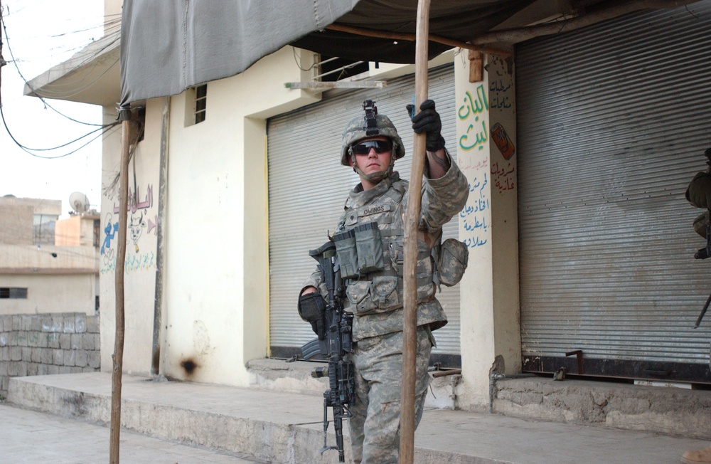 Soldiers Walk Through Al-Karama Neighborhood