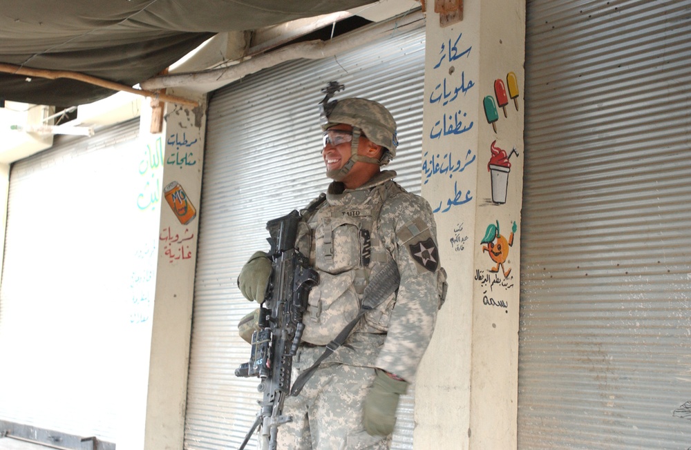 Soldiers Walk Through Al-Karama Neighborhood