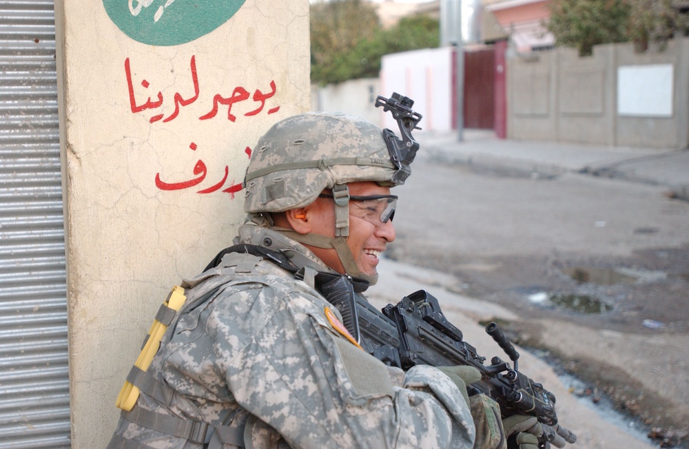 Soldiers Walk Through Al-Karama Neighborhood