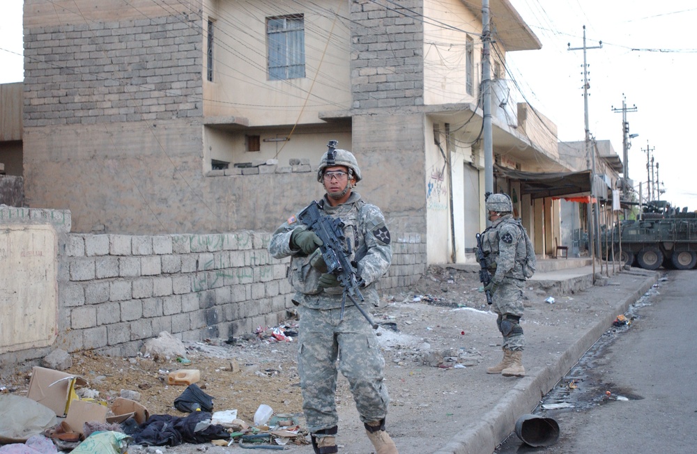 Soldiers Walk Through Al-Karama Neighborhood