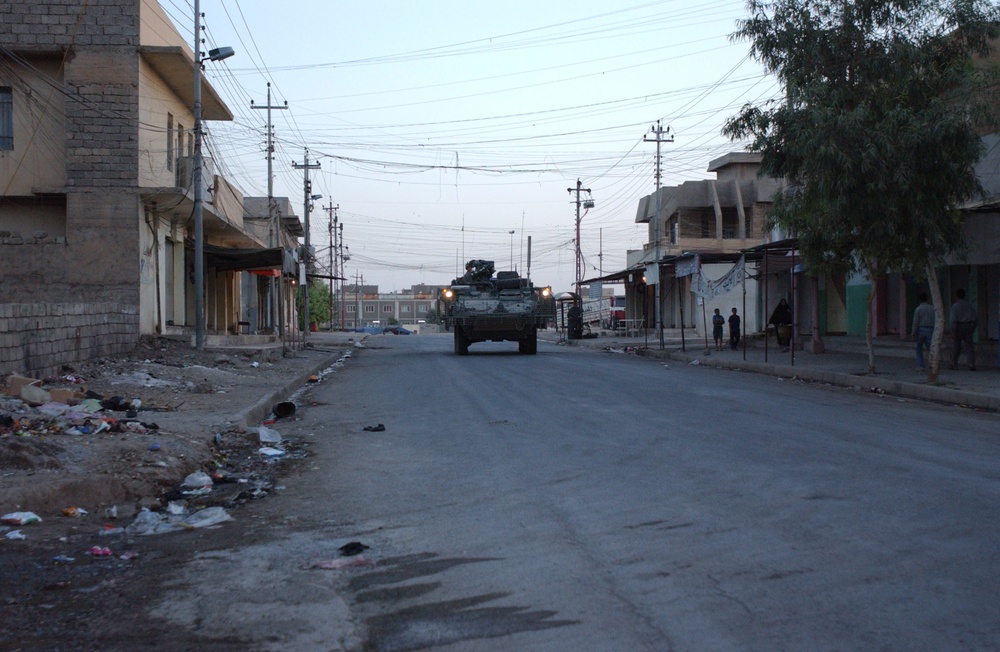 Soldiers Walk Through Al-Karama Neighborhood