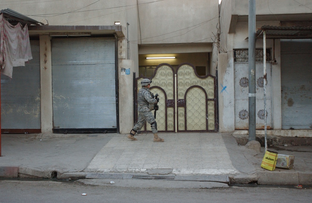 Soldiers Walk Through Al-Karama Neighborhood