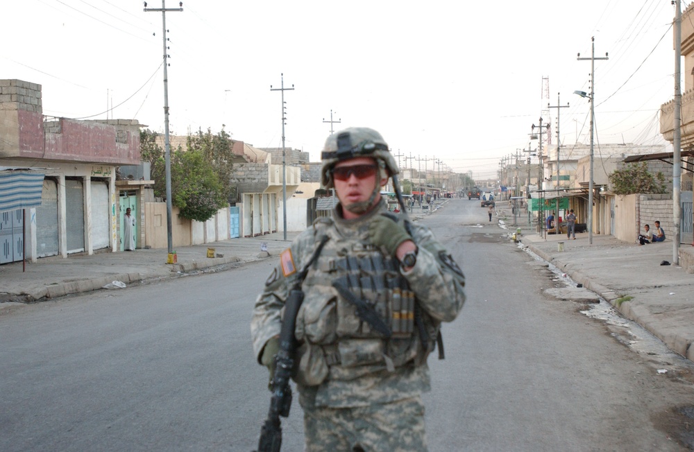 Soldiers Walk Through Al-Karama Neighborhood