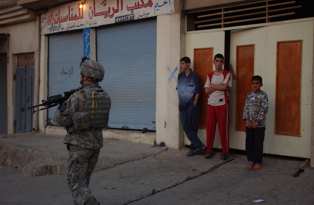 Soldiers Walk Through Al-Karama Neighborhood